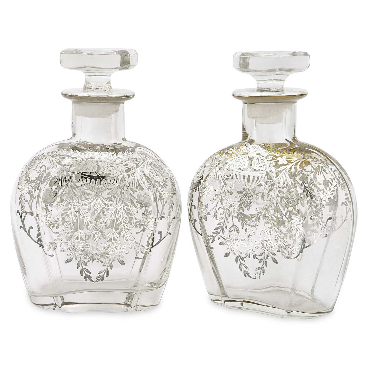 Lot 3 - An early 20th century pair of silver inlaid antique decanters with stoppers. Circa 1920.