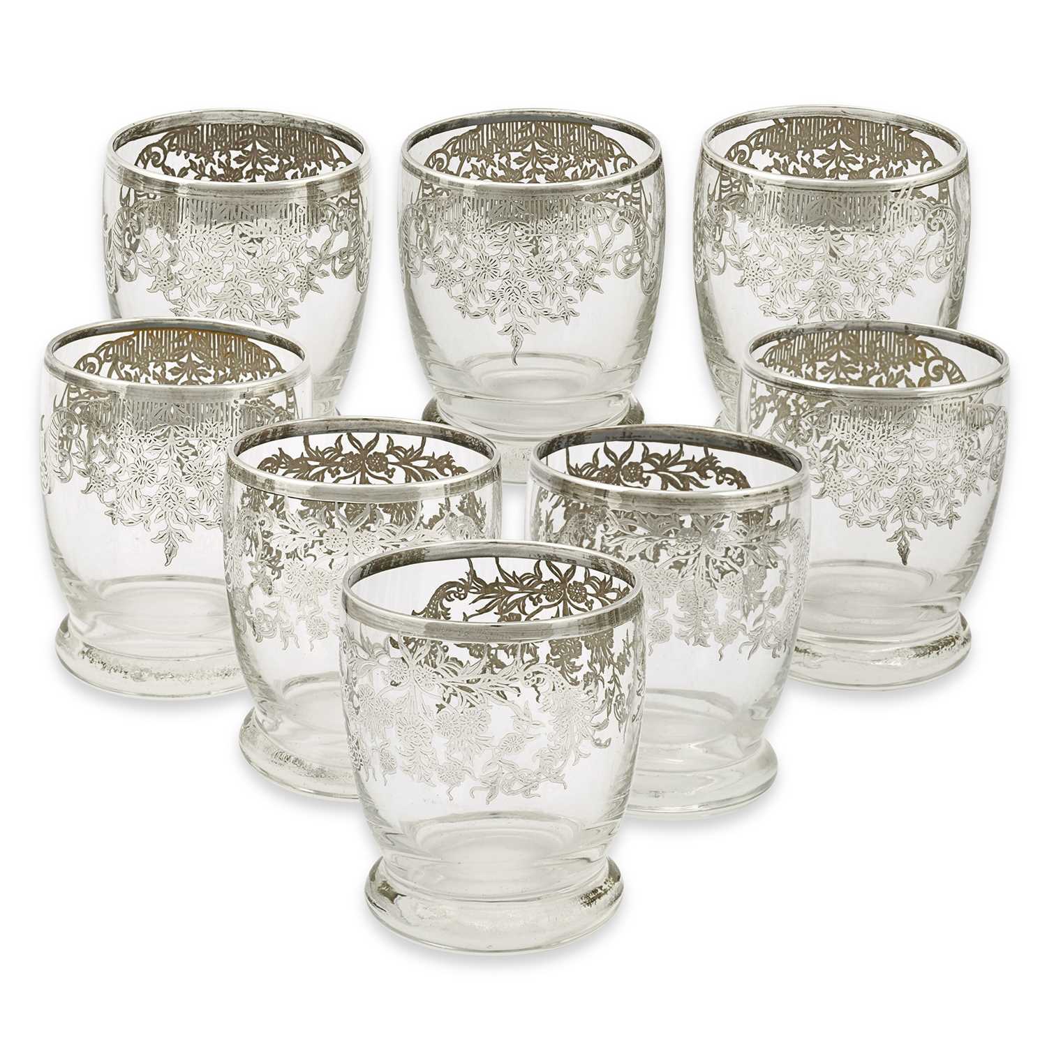 Lot 7 - A set of 8 first quarter 20th century drinking glasses gilded with silver.