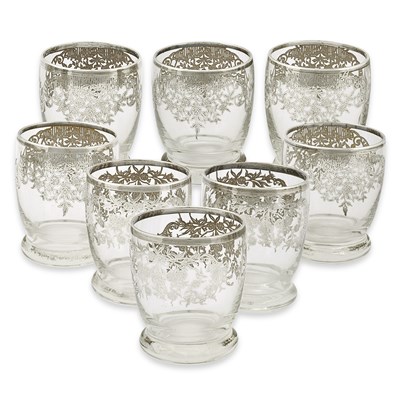 Lot 7 - A set of 8 first quarter 20th century drinking glasses gilded with silver.