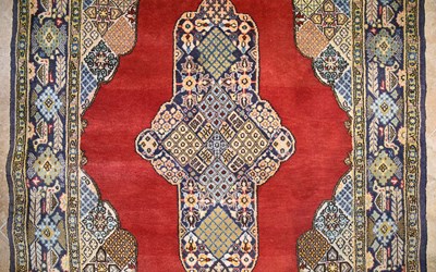 Lot 10 - Wool Qum carpet of geometrical and medallion design