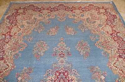 Lot 23 - Early 20th Century large French Kerman carpet with floral designs on turquoise background