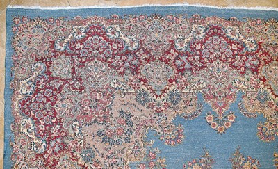 Lot 23 - Early 20th Century large French Kerman carpet with floral designs on turquoise background