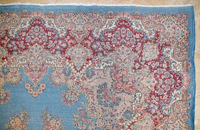 Lot 23 - Early 20th Century large French Kerman carpet with floral designs on turquoise background