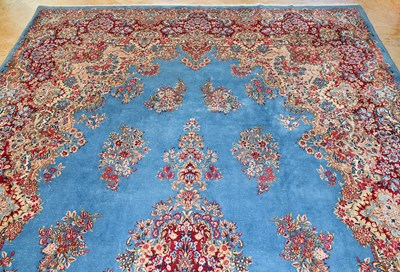 Lot 23 - Early 20th Century large French Kerman carpet with floral designs on turquoise background