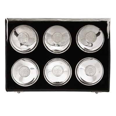 Lot 8 - A boxed set of six Indian silver plates.