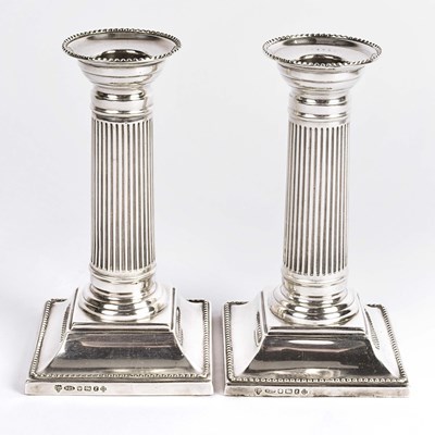 Lot 57 - British silver column candle holders.