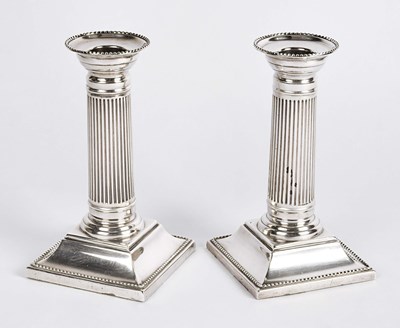 Lot 57 - British silver column candle holders.