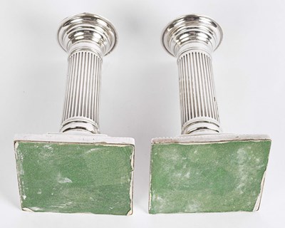 Lot 57 - British silver column candle holders.