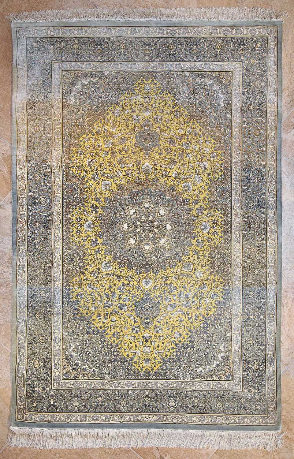 Lot 14 - Signed silk Qum carpet of saffron colors