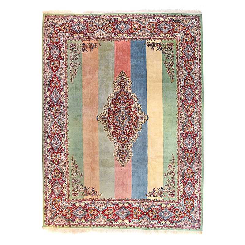Lot 41 - A mid 20th century wool on wool Kerman of open strips field design with rich medallion corners and border design. Circa 1950.