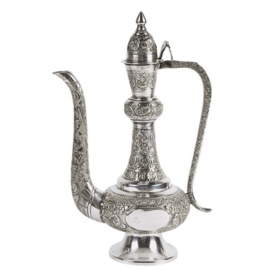 Mid 20th century Indian sterling silver ewer with relief floral design.