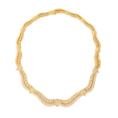 One 18k yellow gold, round brilliant and baguette cutdiamond collar necklace.