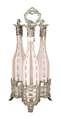 A Bohemian set of three enameled decanters