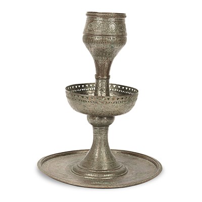 A late 19th century copper candle holder.